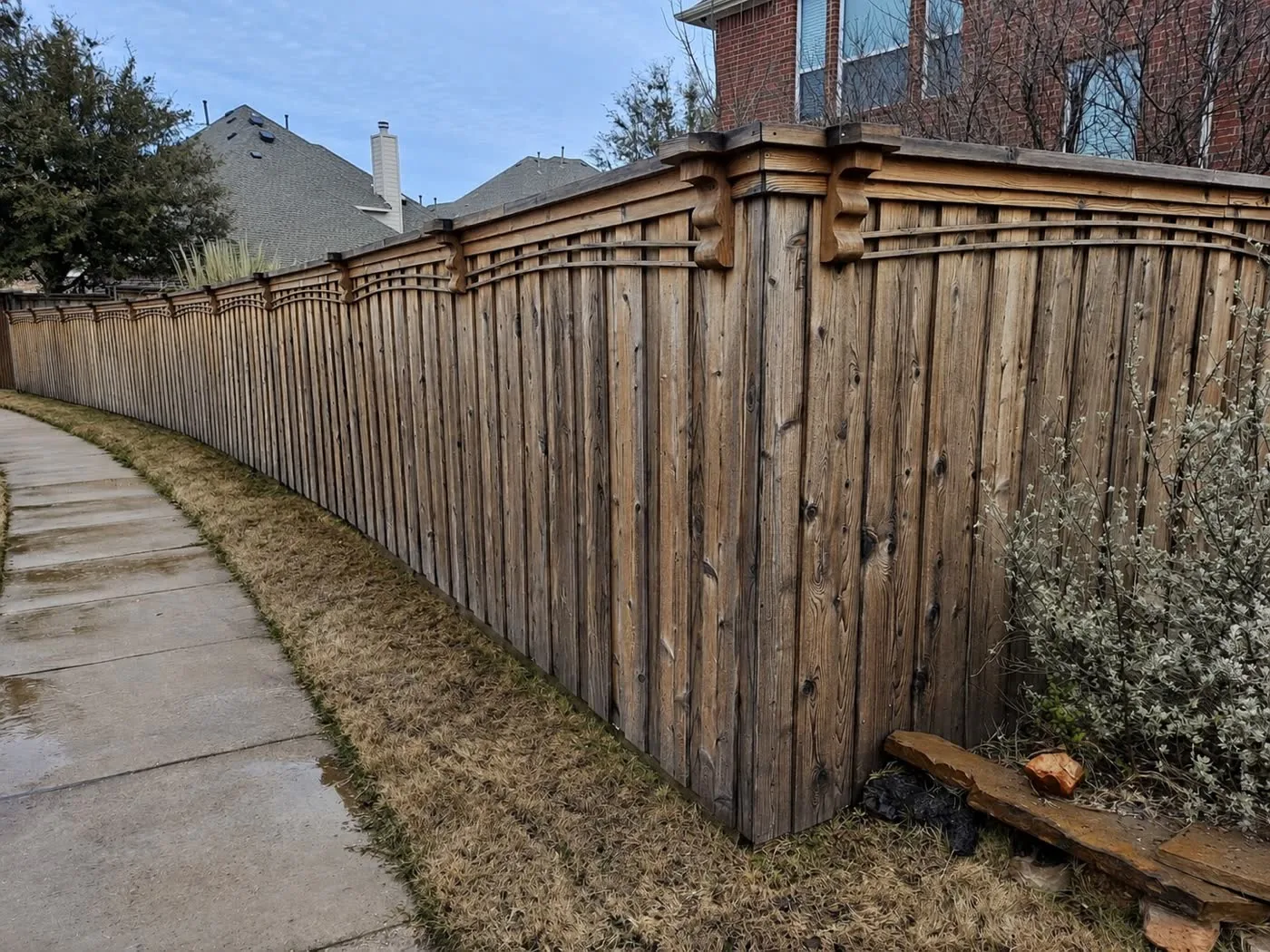Wood privacy fence before pressure washing