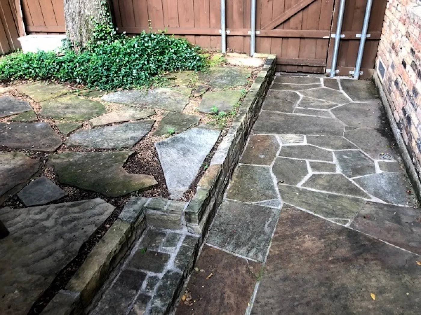 Flagstone patio before pressure washing