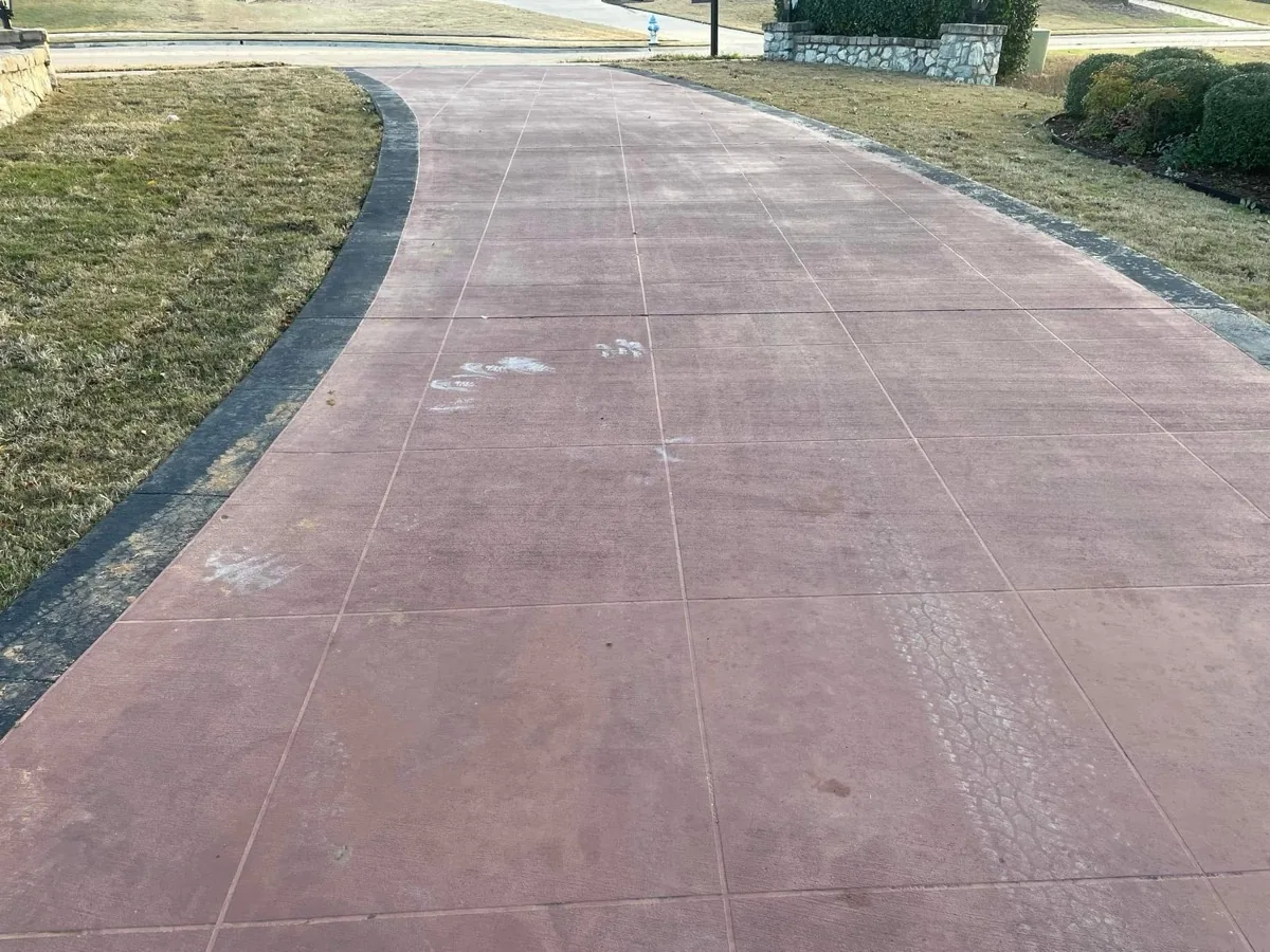 Stamped concrete driveway before pressure washing