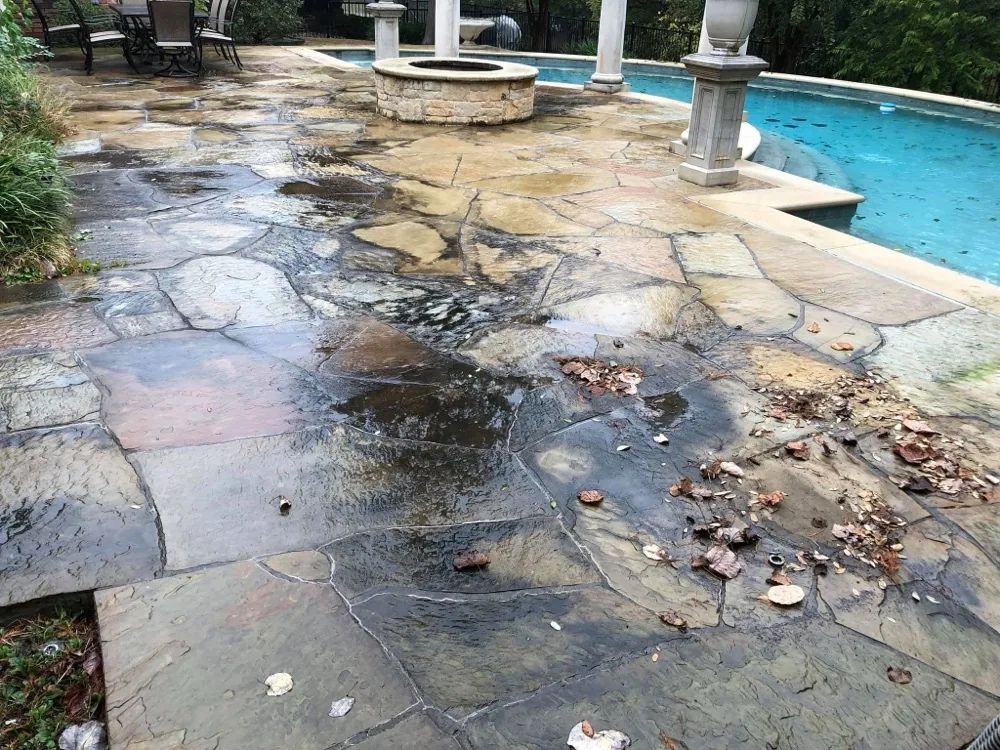 Dirty flagstone pool patio before cleaning